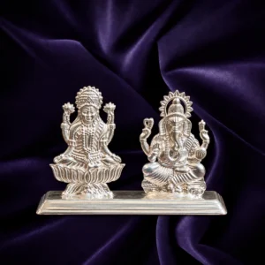 Silver Lakshmi Ganesha idol pair with lotus base