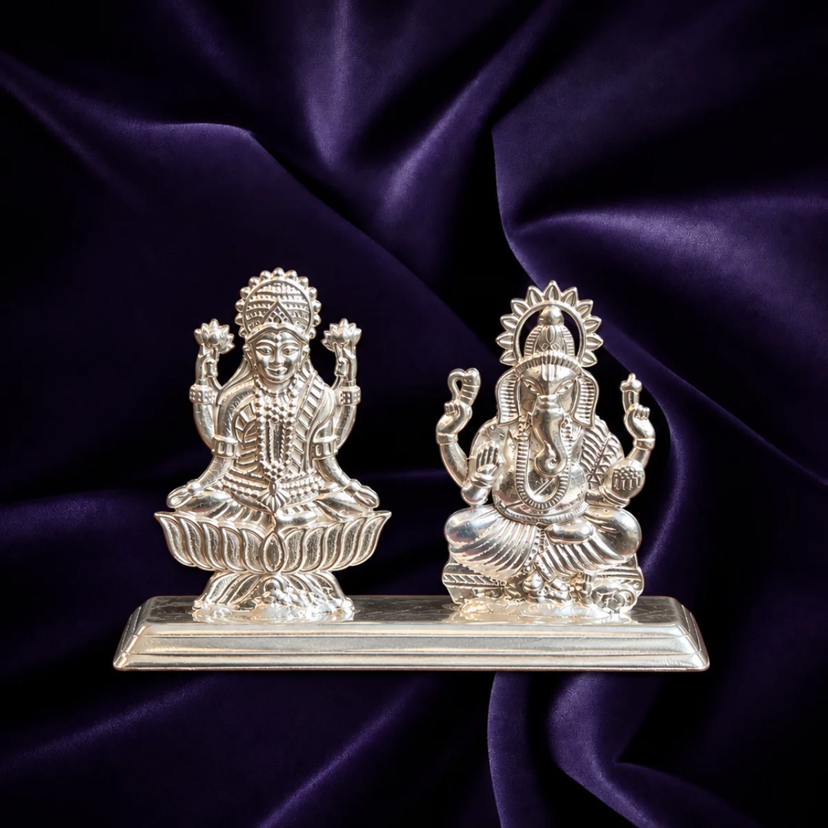Silver Lakshmi Ganesha idol pair with lotus base