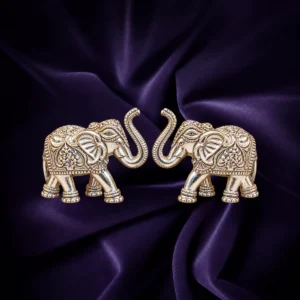 Silver elephant pair idols with raised trunks